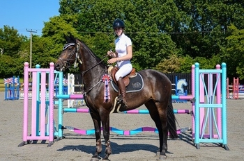 Madeleine Isaacs commands victory in the NAF Five Star Summer Silver League Qualifier at Codham Park      